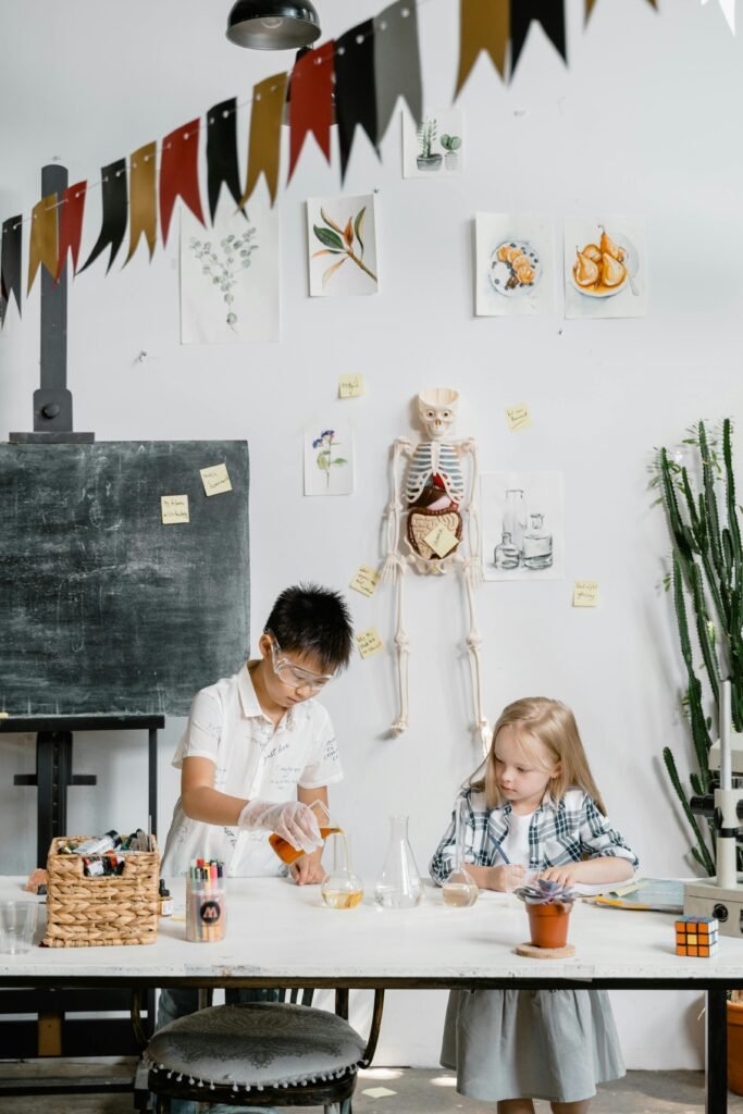 Two children conducting an engaging science experiment in a bright classroom with educational tools.